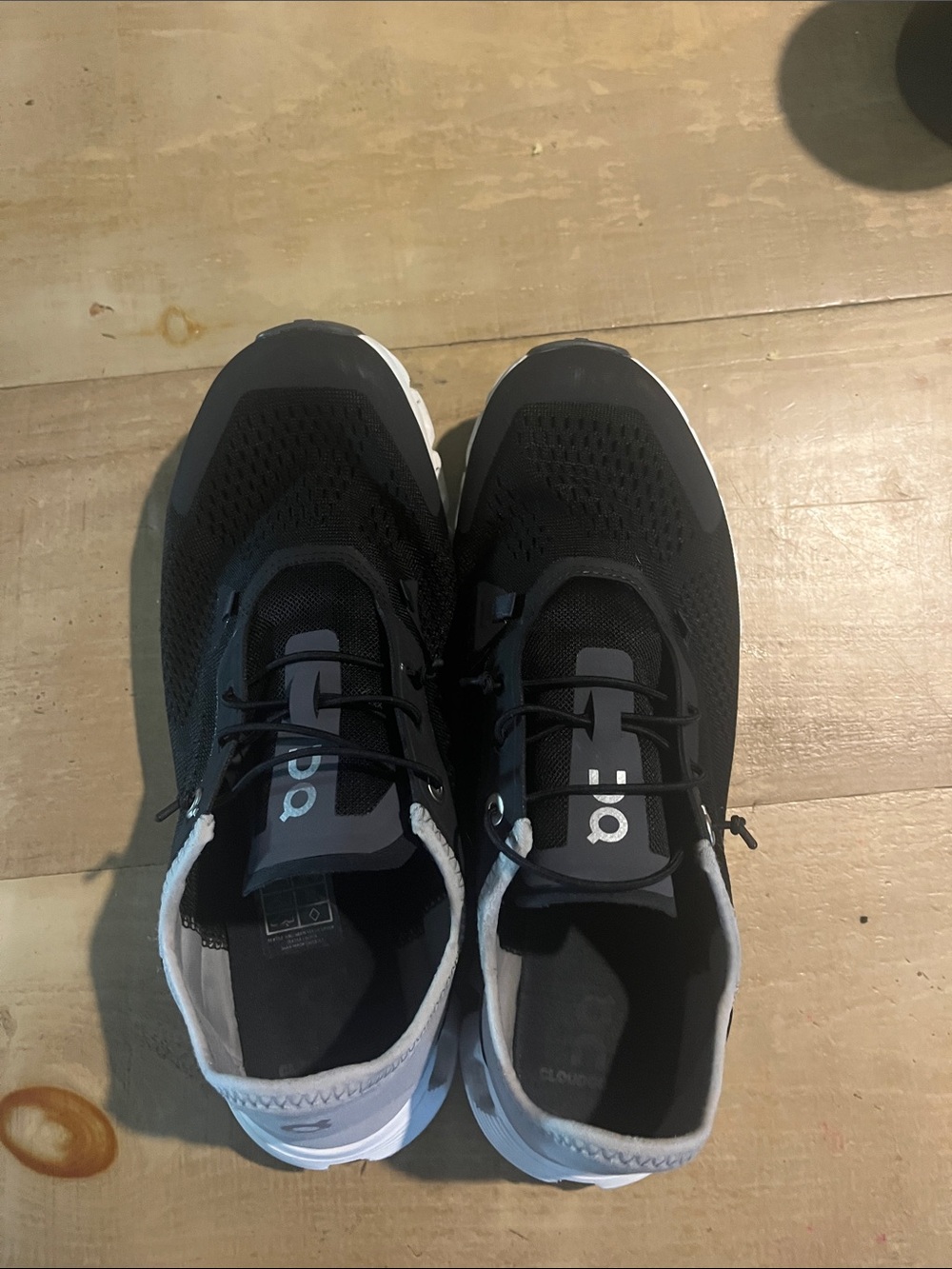 On Running Men’s Black gray and white shoes